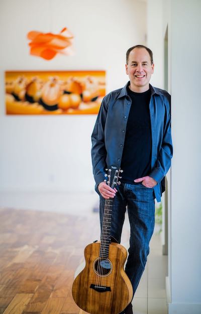 Y. Dan Rubinstein with guitar