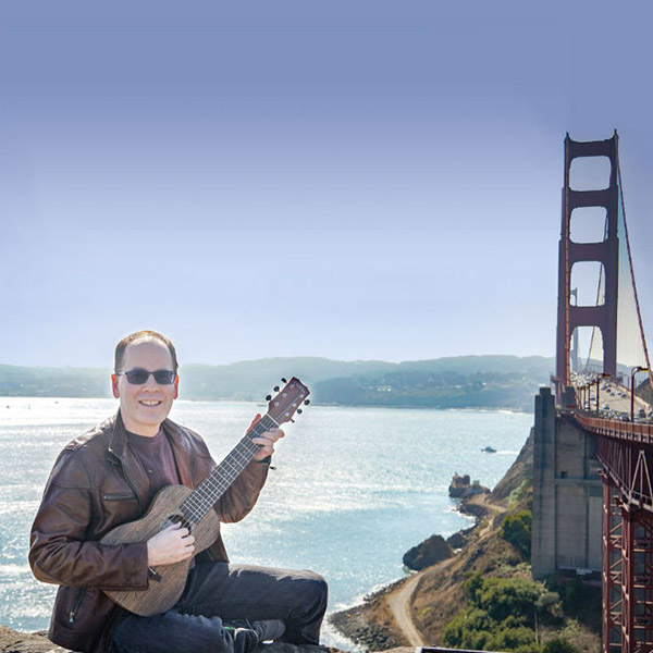 Y. Dan Rubinstein with guitar
